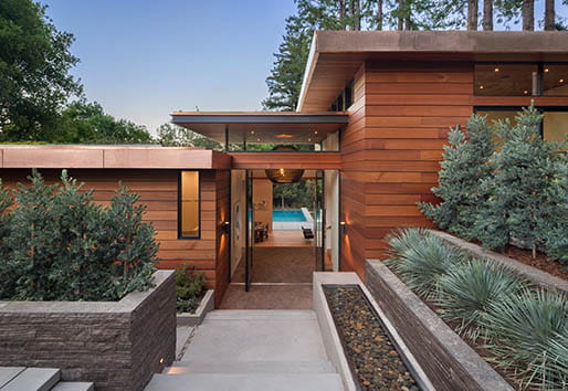 Weiland pivot door, entry doorNOTE: AW door products in great room, kitchen & entry only (windows NOT AW)Modern/Contemporary home styleWoodside Way, Ross, CADeveloper: Amalfi InvestmentsArchitect: David Kotzebue, Kotzebue ArchitectureKeywords: mixed materials, wood, stone, concrete, redwood trees, entry