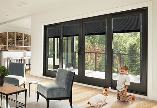 A-Series Frenchwood Gliding Patio Door with Slate Gray Blinds-Between-the-GlassFour panel configuration, black exterior, prefinished black interiors, Albany hardware and Auxiliary Foot Locks in black finish.